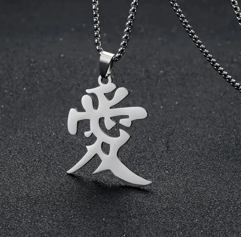 Steel pendant shaped like the Japanese character for love